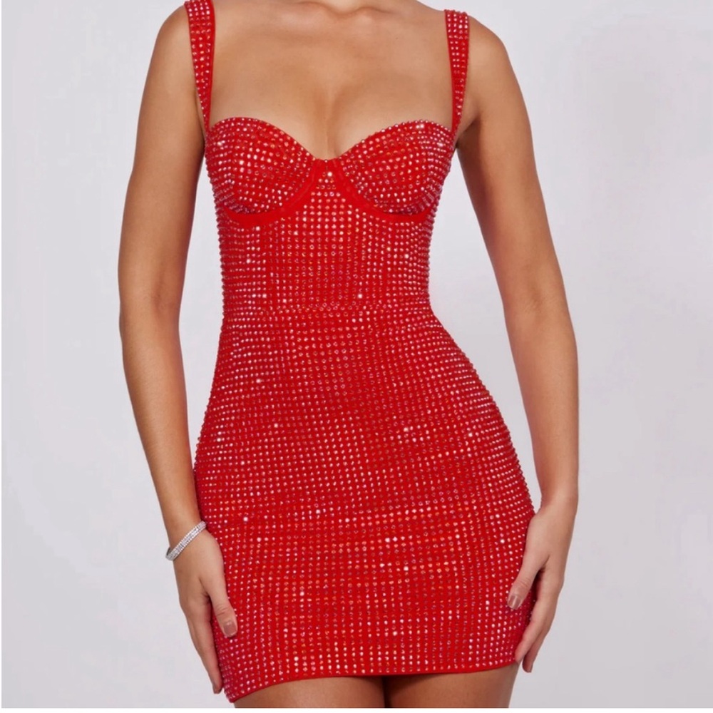 Gorgeous red mini dress. Adorned with delicate hand embellishments.